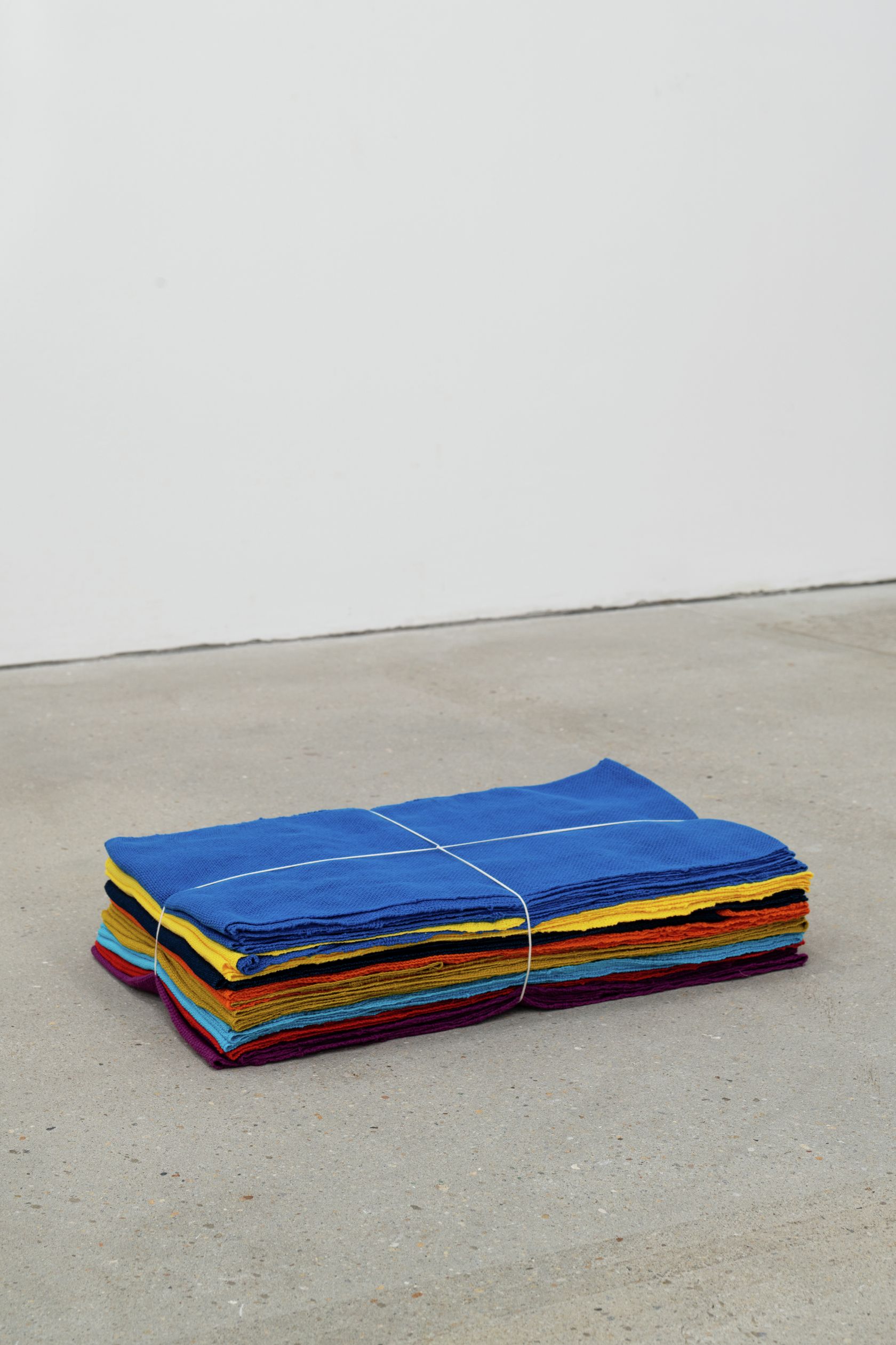 Jason Dodge, In Hong Kong, several weavings, the combined length of the yarn that was woven, equals the distance from the earth 